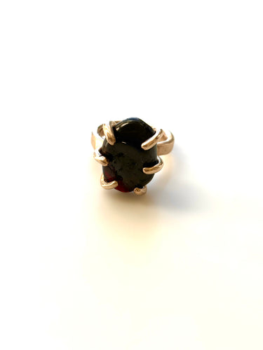 Polished garnet claw set ring