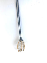 Herkimer diamond caged in bronze