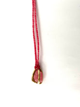 Rhodonite crystal caged in gold